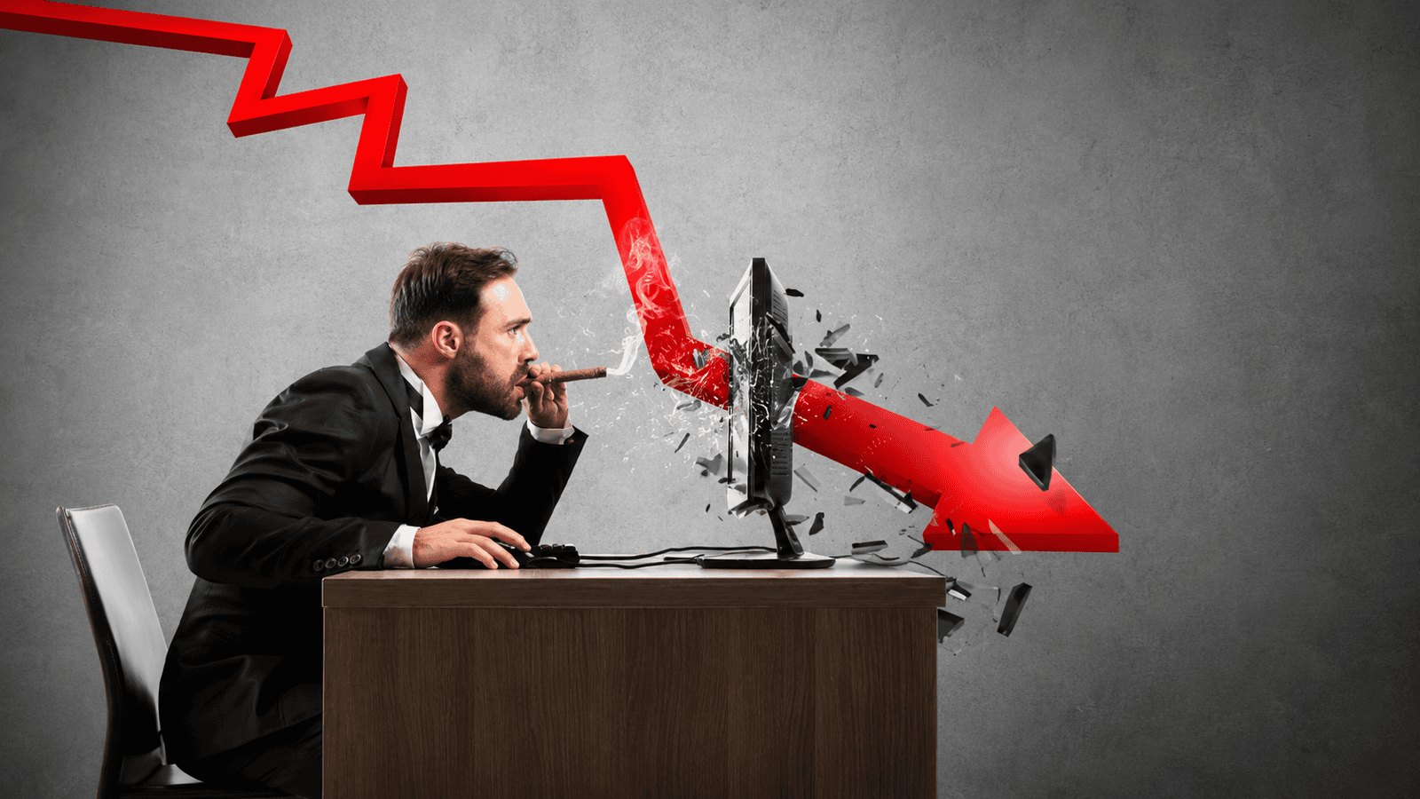 Businessman watching a red downward sales arrow crash through a computer screen, representing lost leads, missed follow-ups, and sales pipeline problems for small businesses in London, Ontario.
