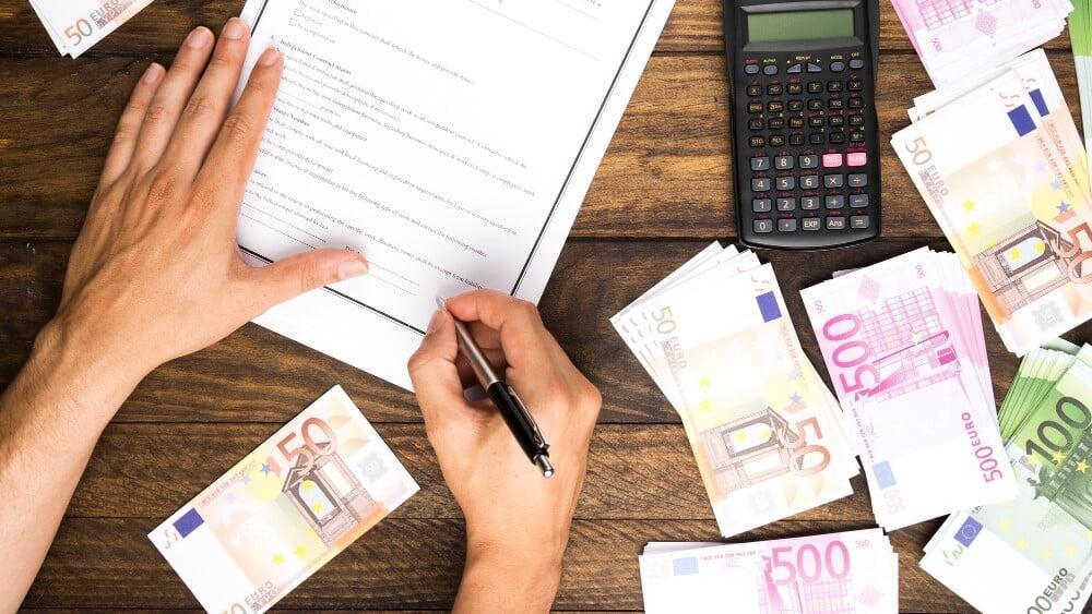 Corporate tax filing preparation for Canadian businesses reviewing financial records and documents for CRA T2 return