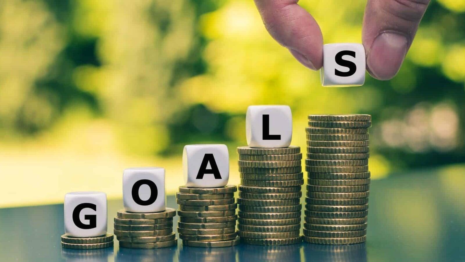 Coins stacked in ascending order with letter blocks spelling “goals,” representing financial target setting, tax savings planning, and revenue growth objectives for businesses in London, Ontario, Canada in 2026.
