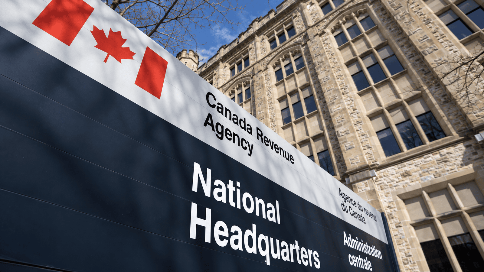 Canada Revenue Agency headquarters sign with the Canadian flag, representing refundable corporate tax mechanisms that may return part of investment income tax when dividends are paid.