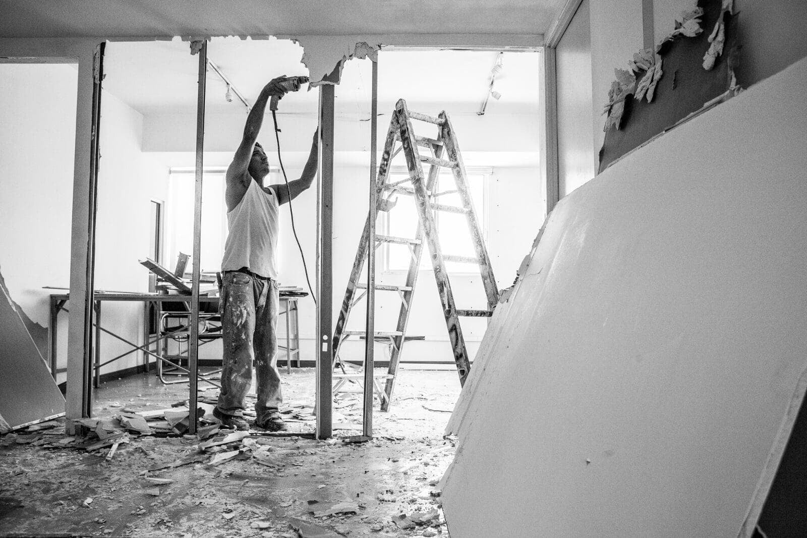 Drywall contractors working on an interior construction project