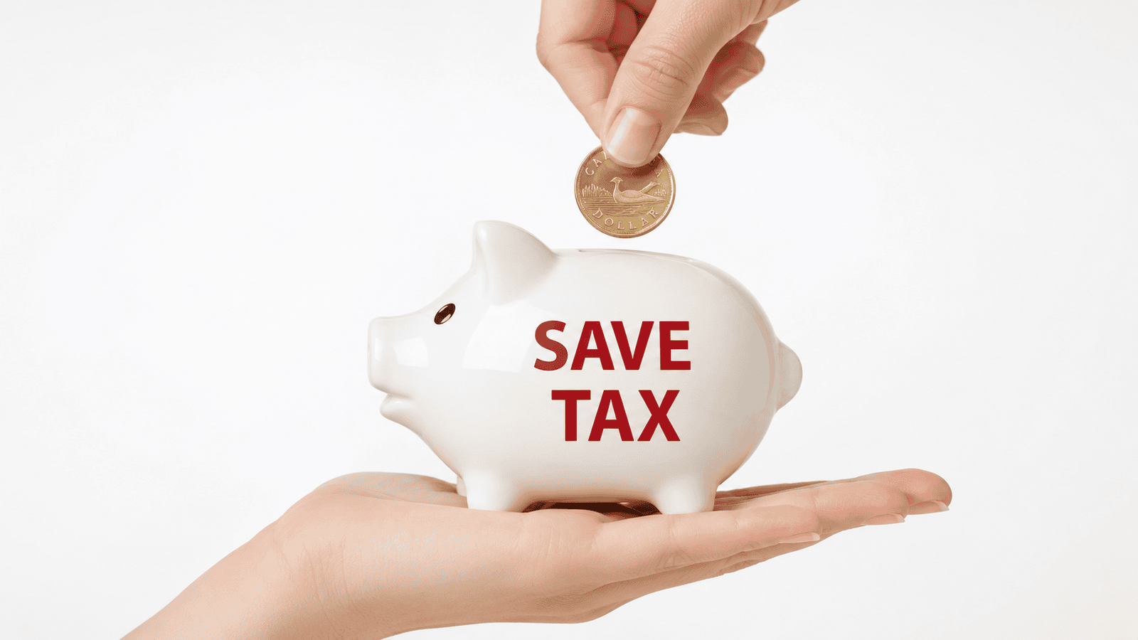 Close-up of a white piggy bank labeled “SAVE TAX” as a hand drops a coin into it, representing proactive tax planning, organized bookkeeping, and smart financial management for Canadian small businesses.